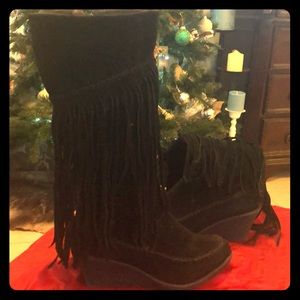 Knee high fringe boots